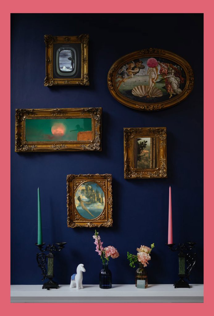 A wall of pictures with candles on a side board and flowers in vases.