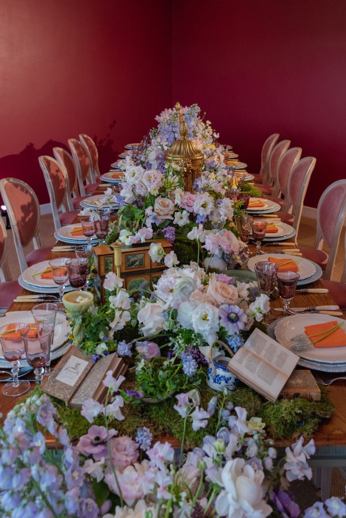 A runner of spring flowers in various hues and colours