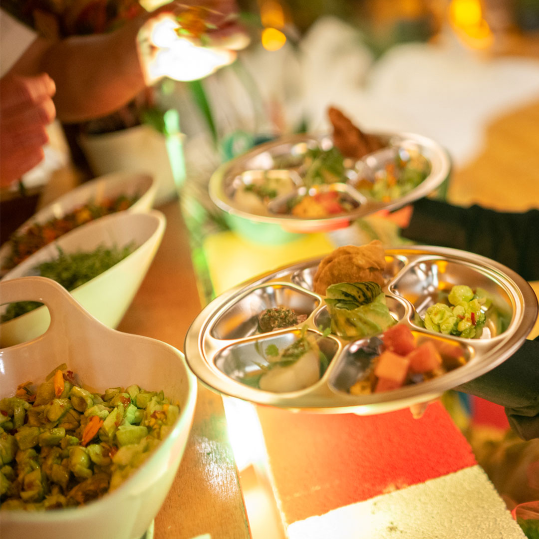 A metal mess tray of food