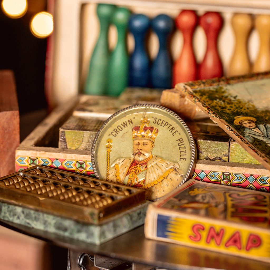 Wooden skittles, puzzle game, SNAP cards and metal abacus.