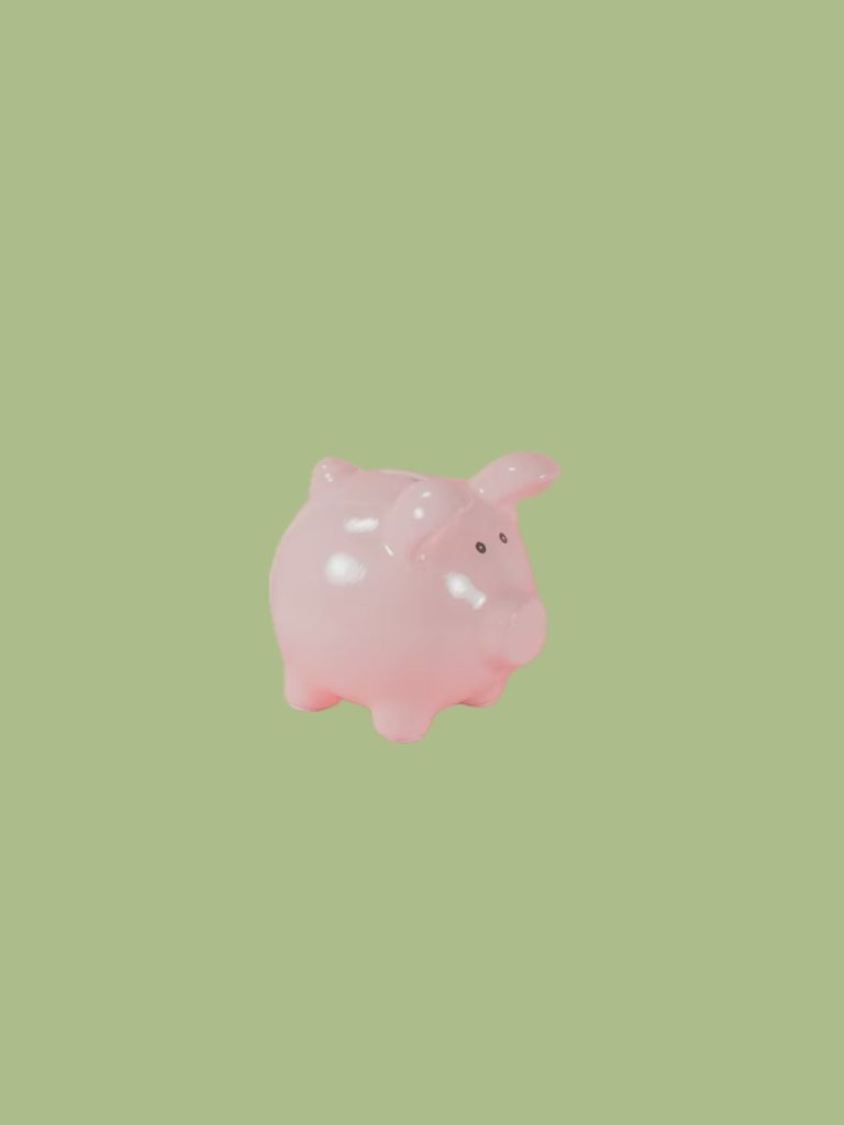 A pink piggy bank on a green background.
