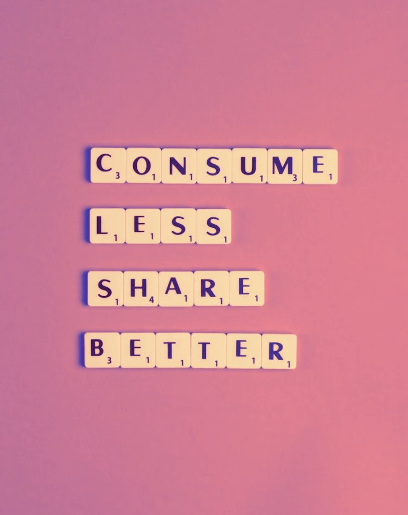 Consume Less Share Better on a pink background.
