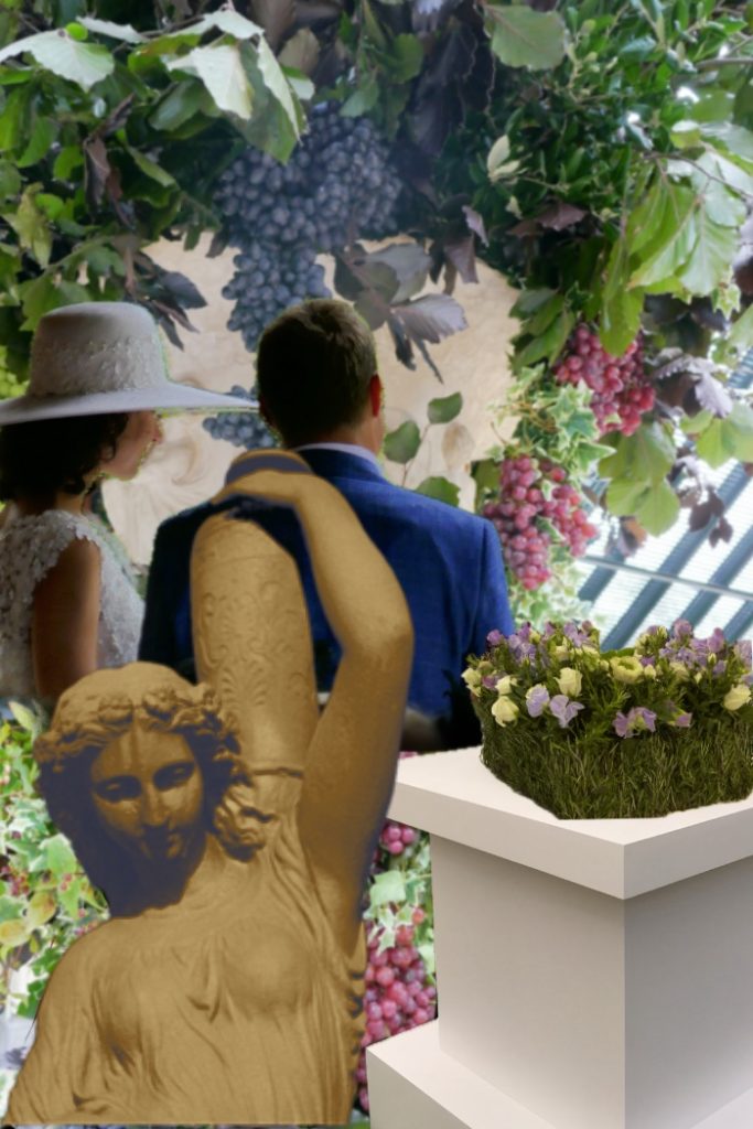 A garden scene showing a couple getting married and a plinth of flowers and a statue.