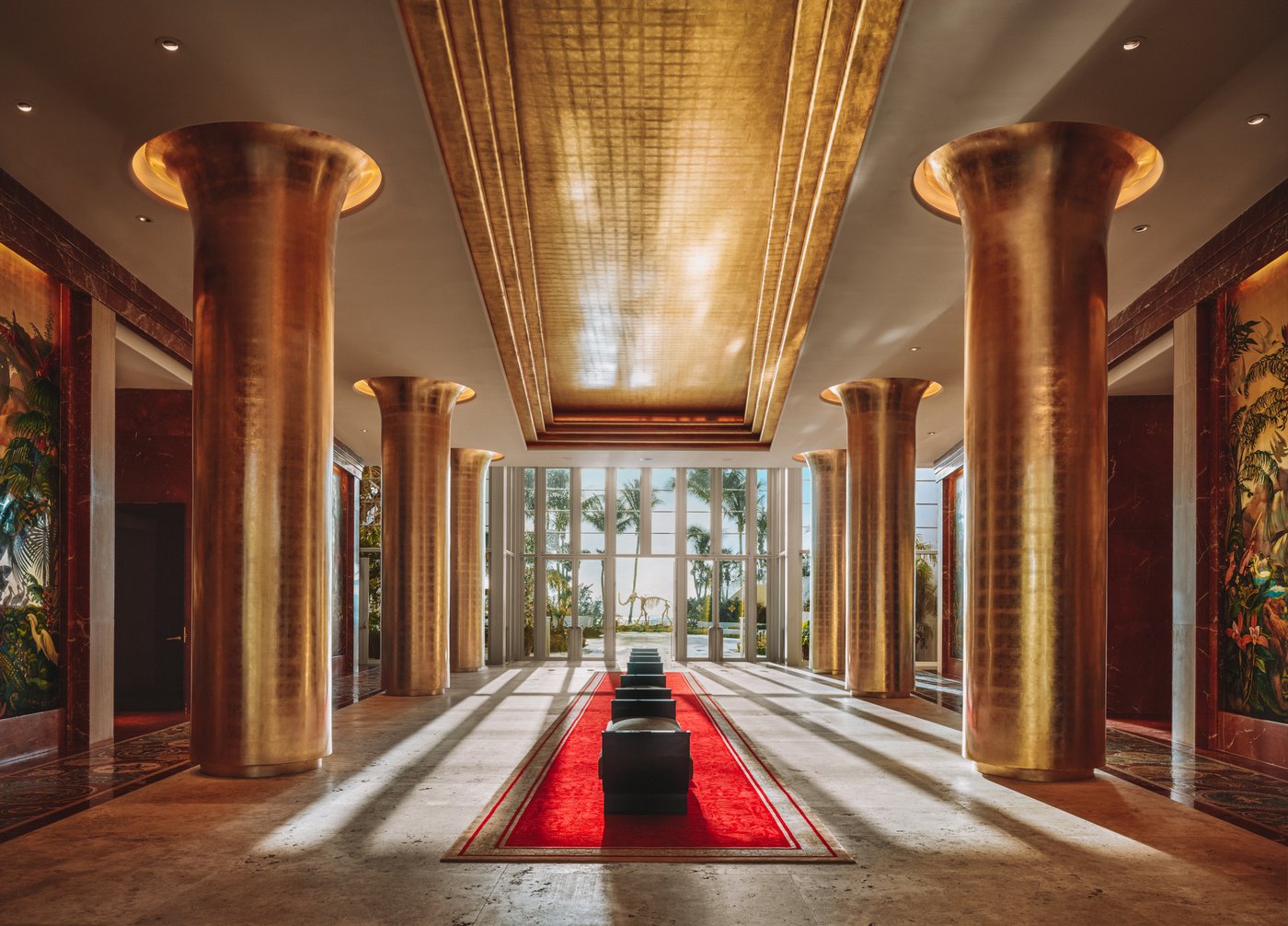 The Cathedral at Faena Miami Beach, its vaulted ceiling and gilded columns rising above a candlelit dinner