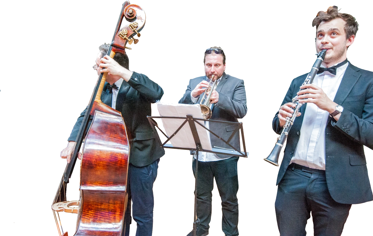 A cut-out of a jazz trio, double bass, trumpet and clarinet, from the artwork for A Night at The Museum.