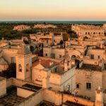 Il Borgo at sunset with the Adriatic on the horizon. Borgo Egnazia.