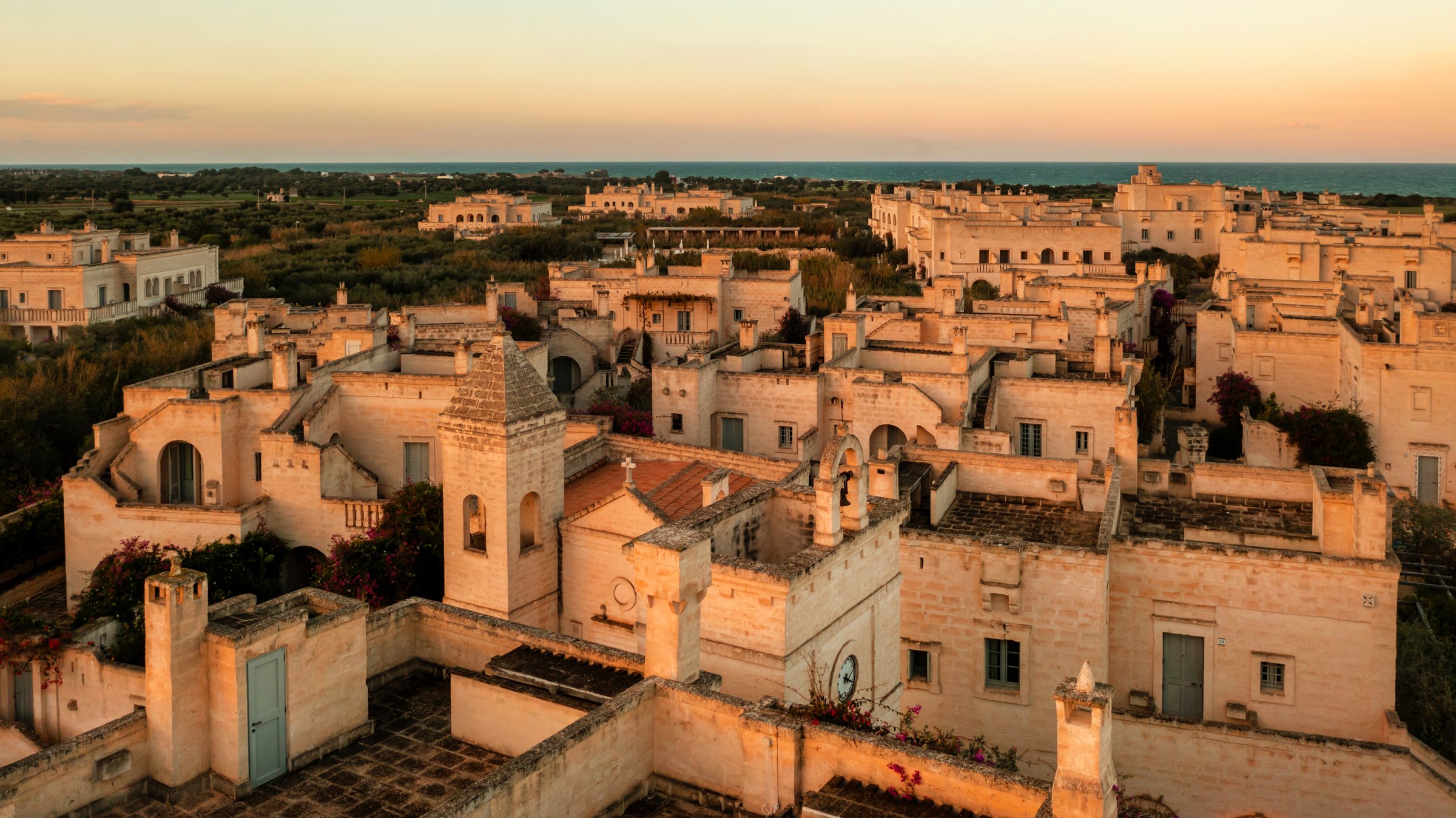 Il Borgo at sunset, the sea on the horizon.