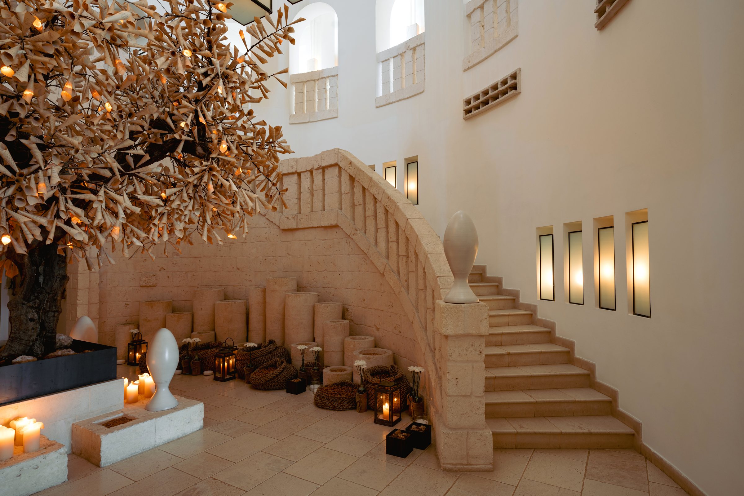 The stair hall at La Corte, with its olive tree.