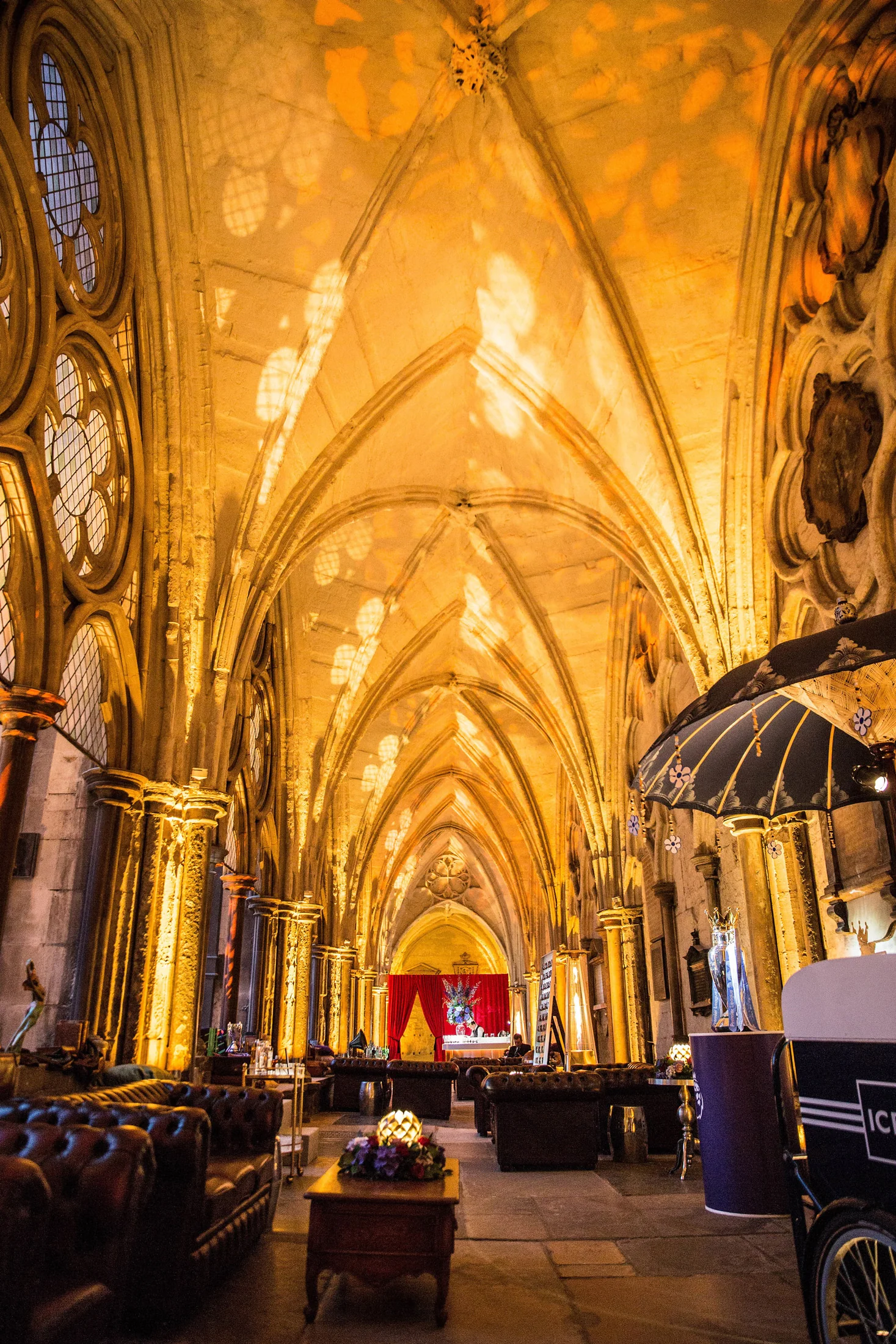 The full height of the gilded arcade with seating, parasols and the food stations running away down it.