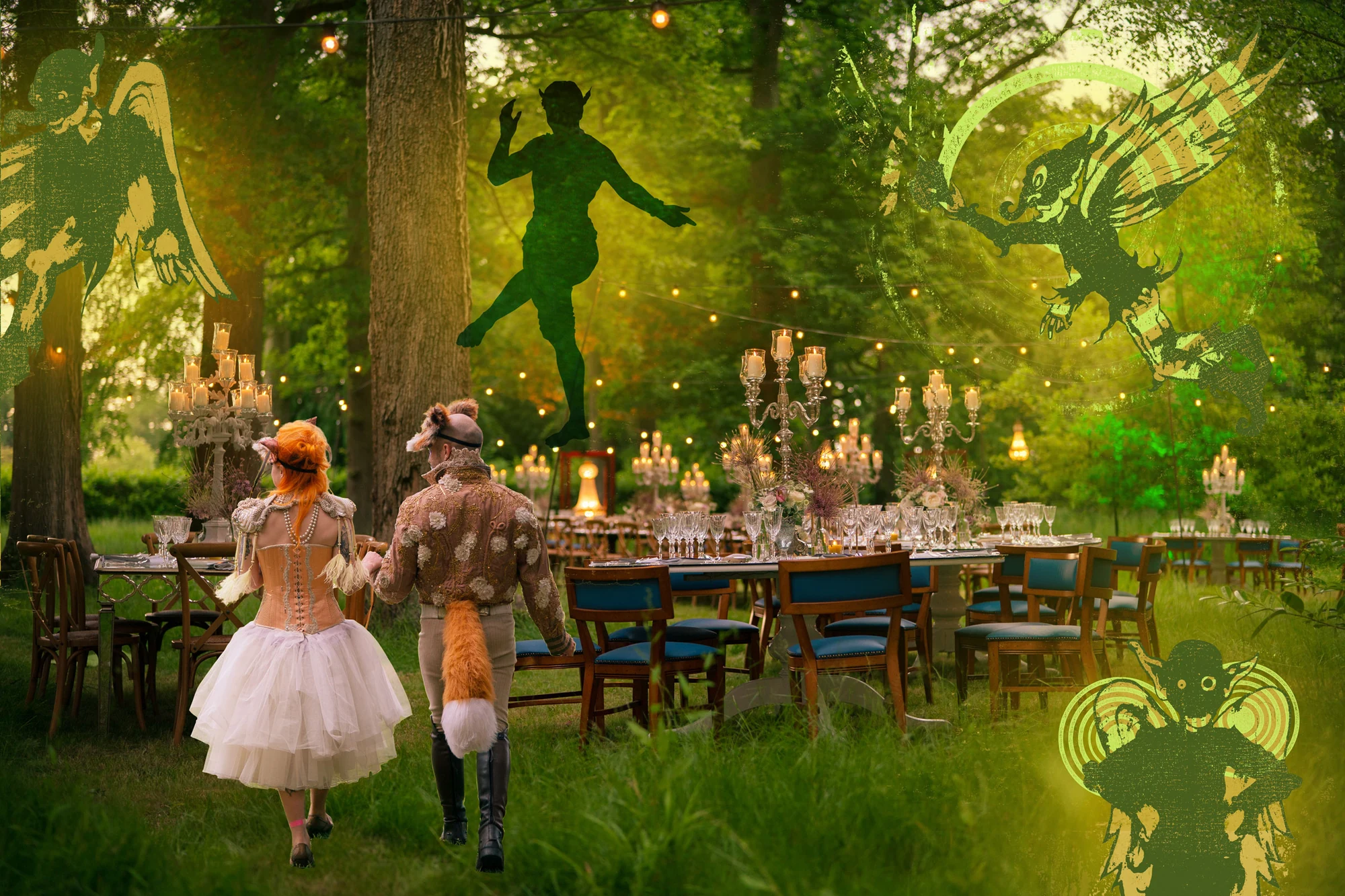 A long table laid and candlelit among trees, two guests in costume walking towards it, with green painted silhouettes of fairies leaping through the branches above.