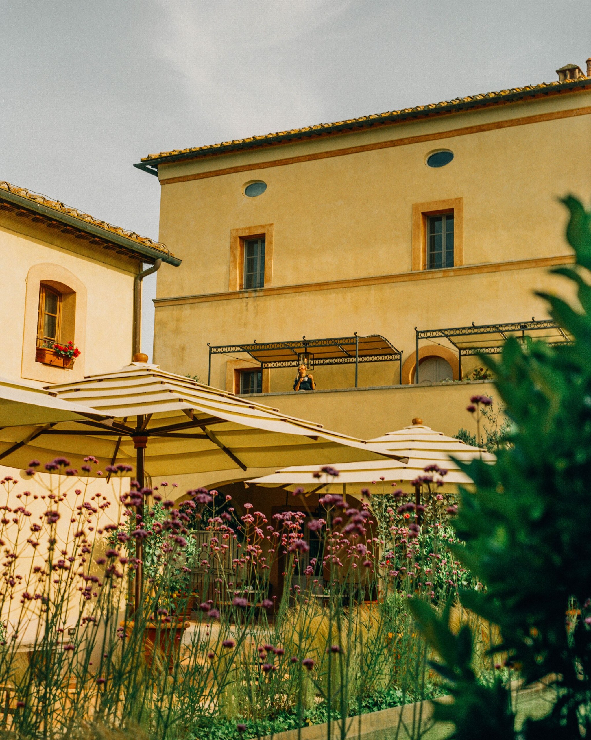 A terrace with striped umbrellas at Castello di Casole.