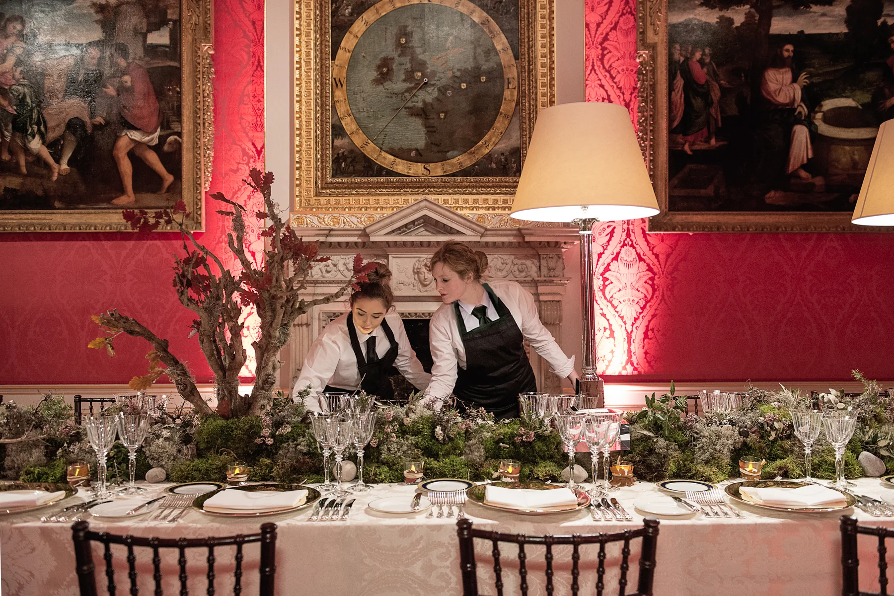 The long table dressed and staff at work, the red state apartment at Kensington Palace behind.